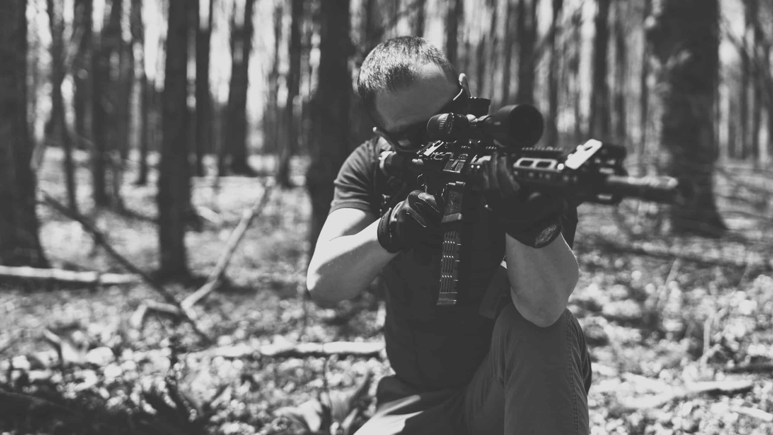 CAT Outdoors Guy Holding a Gun