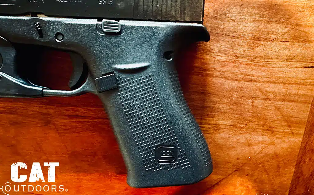 Close up of the 43X grip showing the extended slimline beavertail, textured frame and mag release