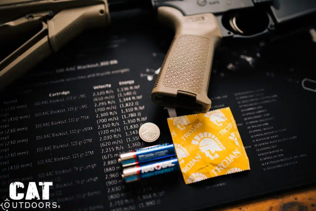 Magpul MOE Pistol Grip Storage with CR2032 battery, AA batteries, Trojan condom