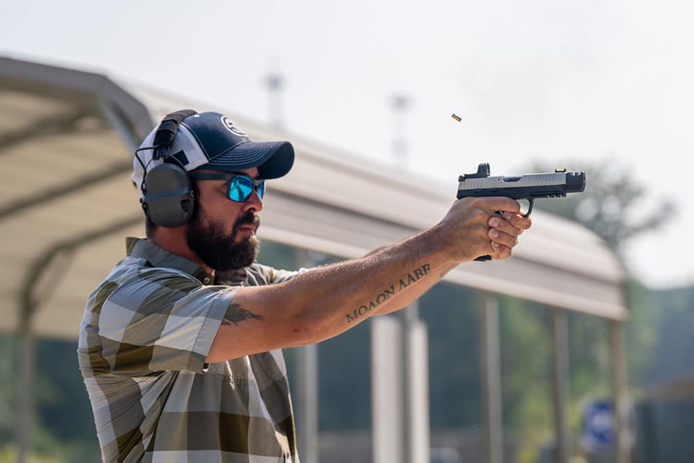 Man shooting a Sig Sauer P322 Pistol