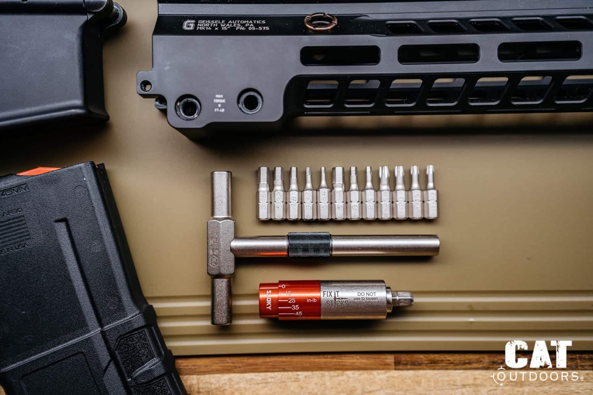 Fix It Sticks kit laid out: T-handle, driver shaft, All-in-One torque limiter and twelve bits