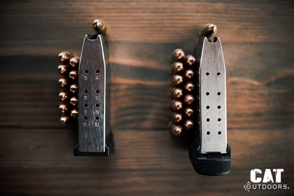 Side view of the Springfield Hellcat magazines showing the numbered round-count cutouts at 5, 4, 7, 6, 9, 8, 11, 10 on the flush mag and additional 13, 12 cutouts on the extended mag