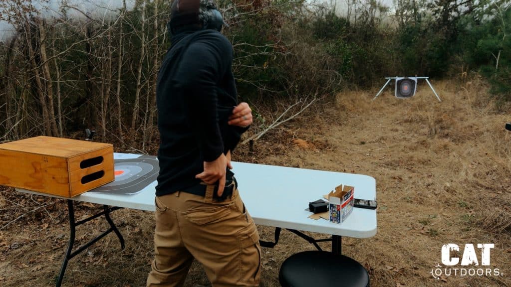 Brad clearing his cover garment to draw the Springfield Hellcat from a Kydex IWB holster at the 4 o'clock carry position