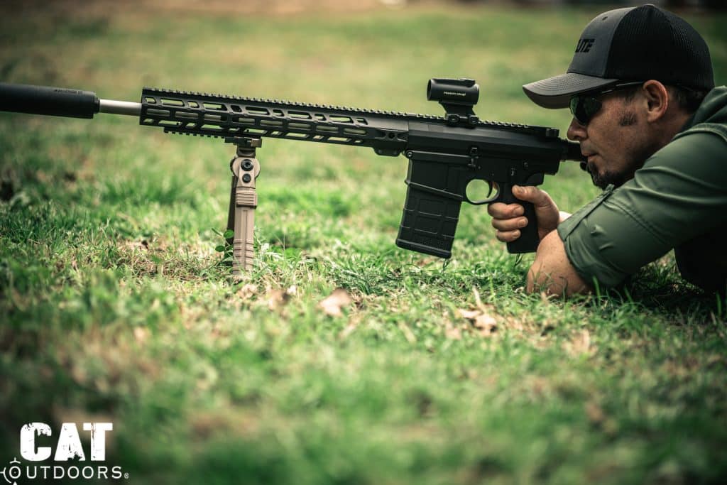 Shooter prone with CVLIFE bipod legs folded forward for low profile shooting