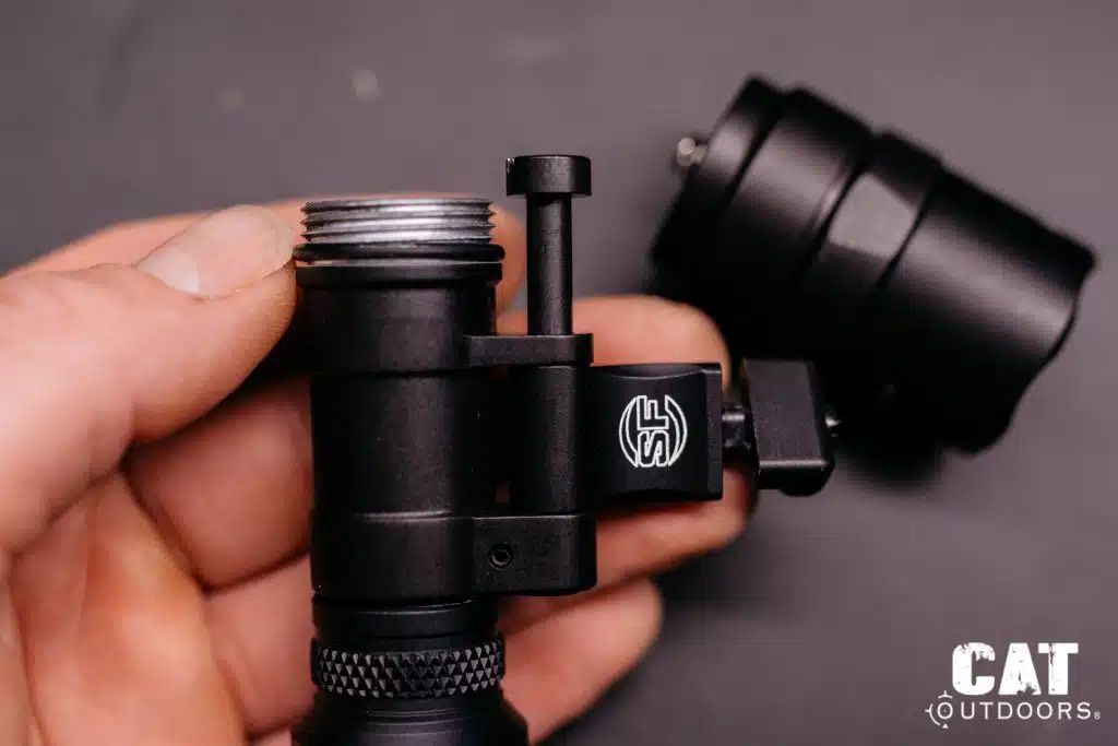 Light head removed, showing the pivot screw fully extended and the only path it can exit the body