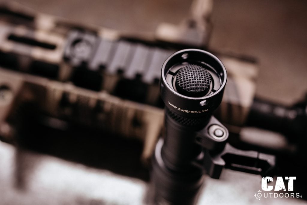 Macro close-up of the Z68 shrouded tailcap, showing rubber click button surrounded by protective shroud