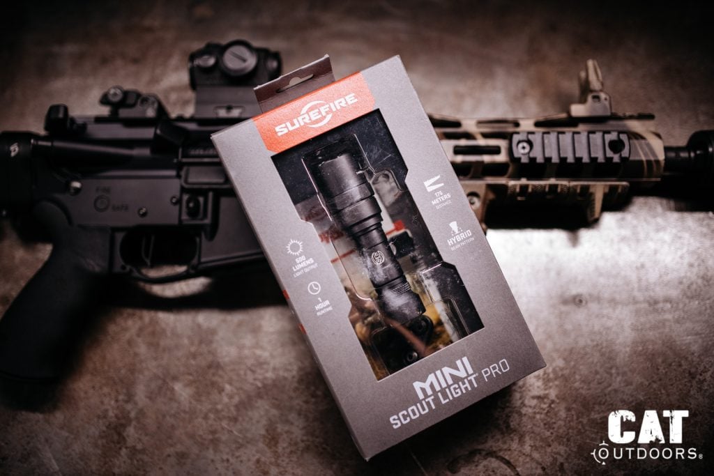 SureFire Mini Scout Light Pro retail packaging showing 500 lumens, 1 hour runtime, 175 meters distance, and hybrid beam pattern callouts