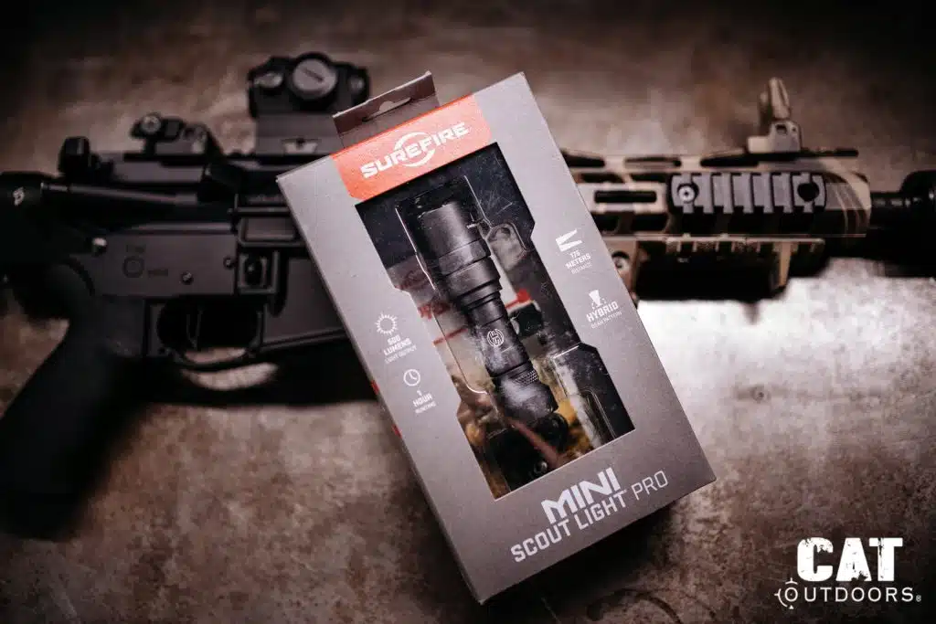 SureFire Mini Scout Light Pro retail packaging showing 500 lumens, 1 hour runtime, 175 meters distance, and hybrid beam pattern callouts