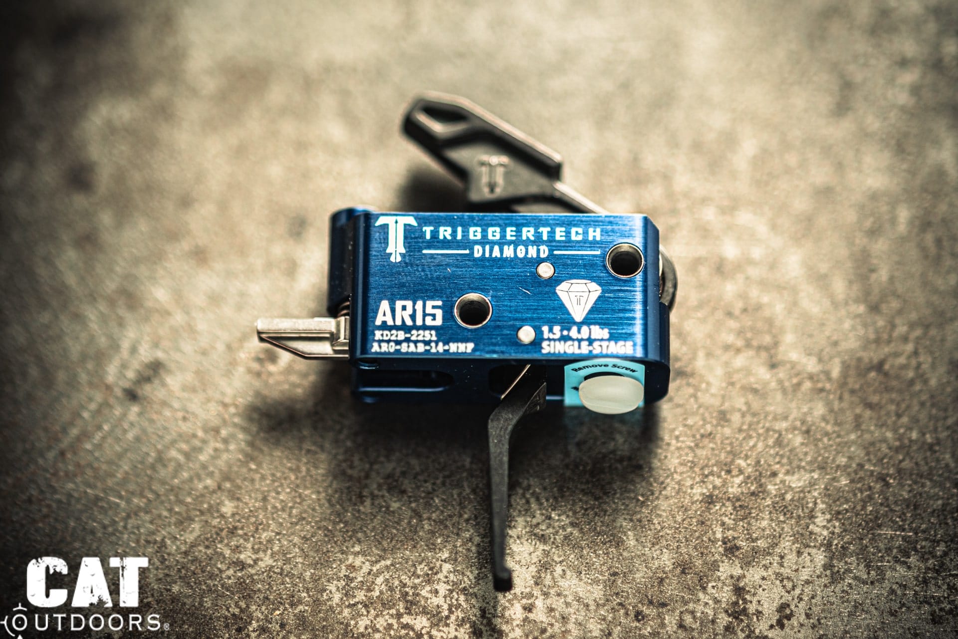 TriggerTech Diamond AR-15 single-stage drop-in trigger with blue anodized housing and flat trigger shoe, marked 1.5-4.0 lbs