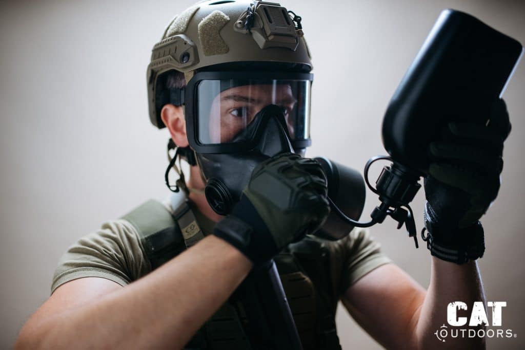 Drinking from the canteen through the Mira Safety CM-8M closed hydration system