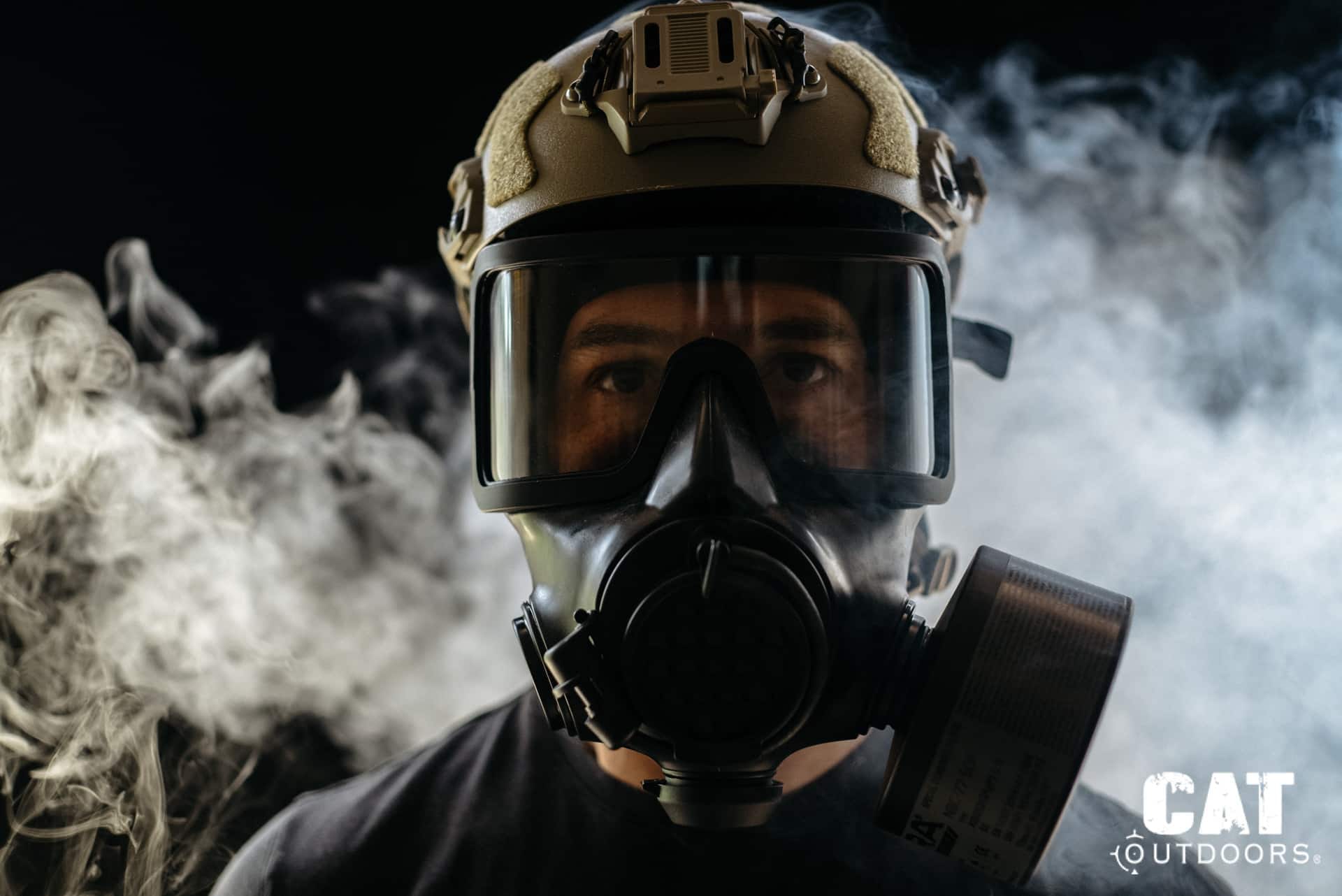 Mira Safety CM-8M gas mask worn with a tactical helmet, surrounded by smoke