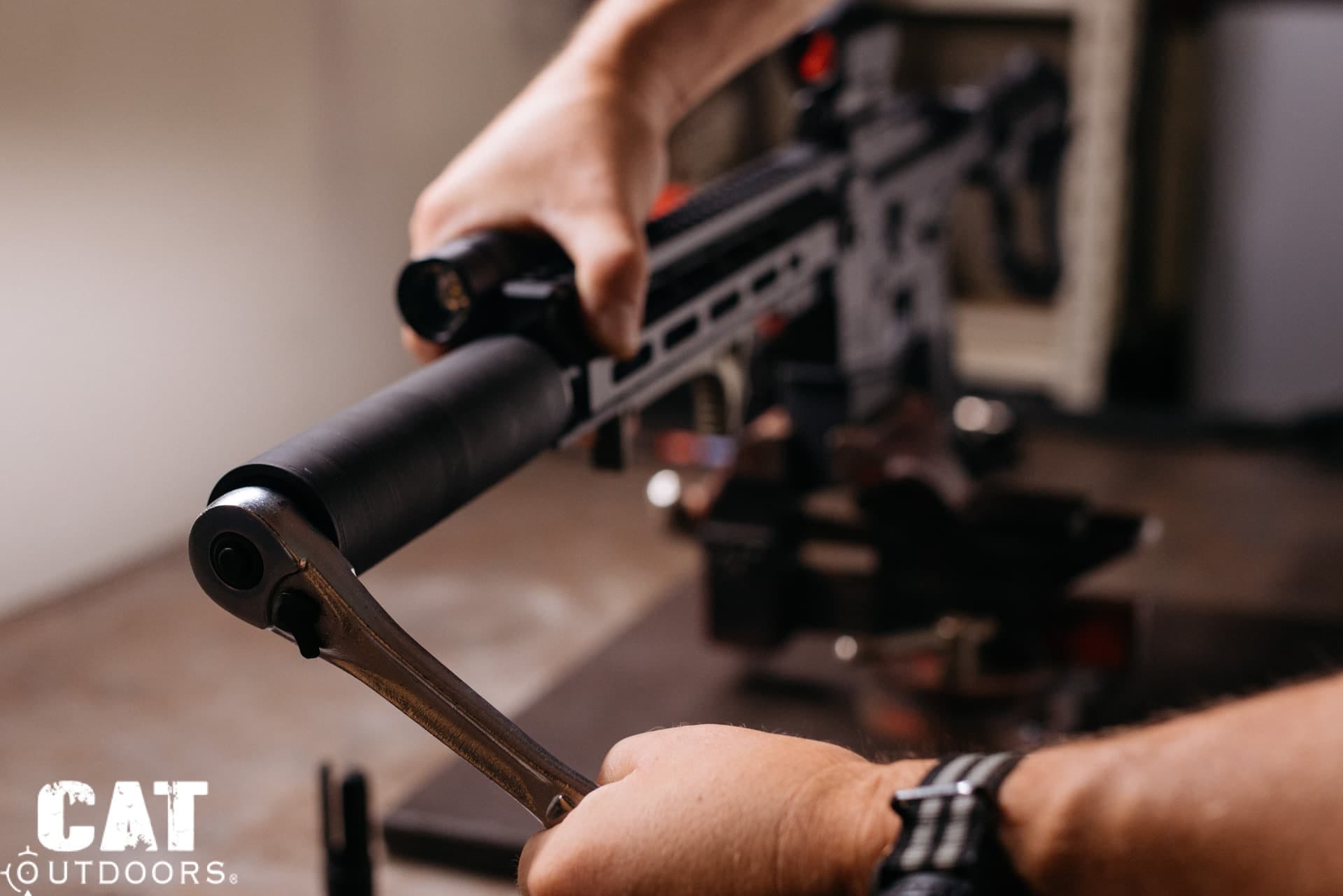 PSA Sabre 300 Blackout build: ratchet wrench tightening the can