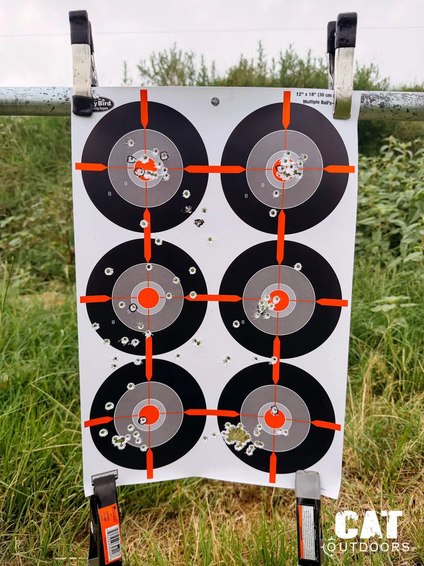 Shooter aiming the suppressed PSA Sabre with the GLx MD-21 reticle glow visible in the rear glass