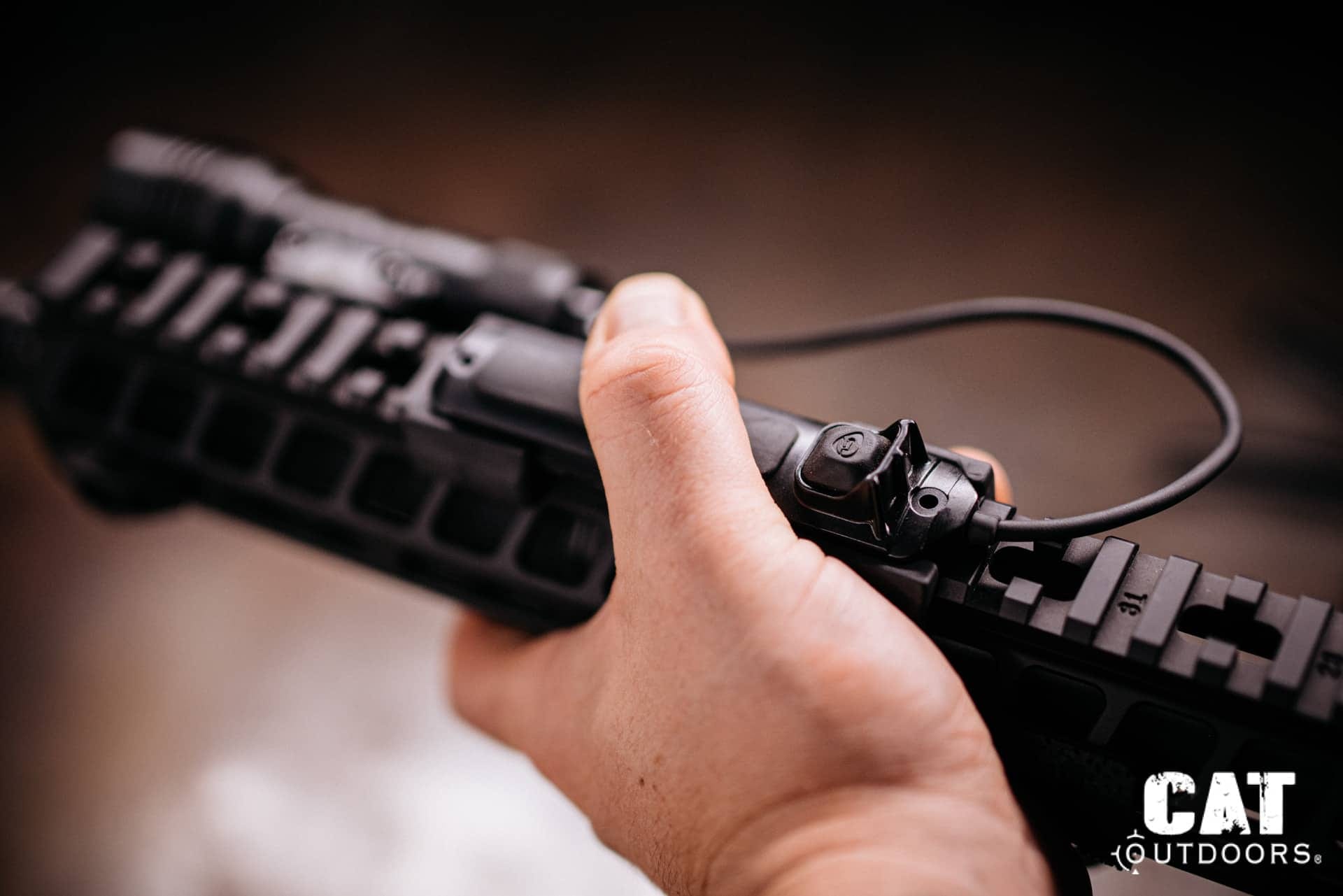 Thumb over the ProTac Rail Mount 1 tapeswitch on top of the rail