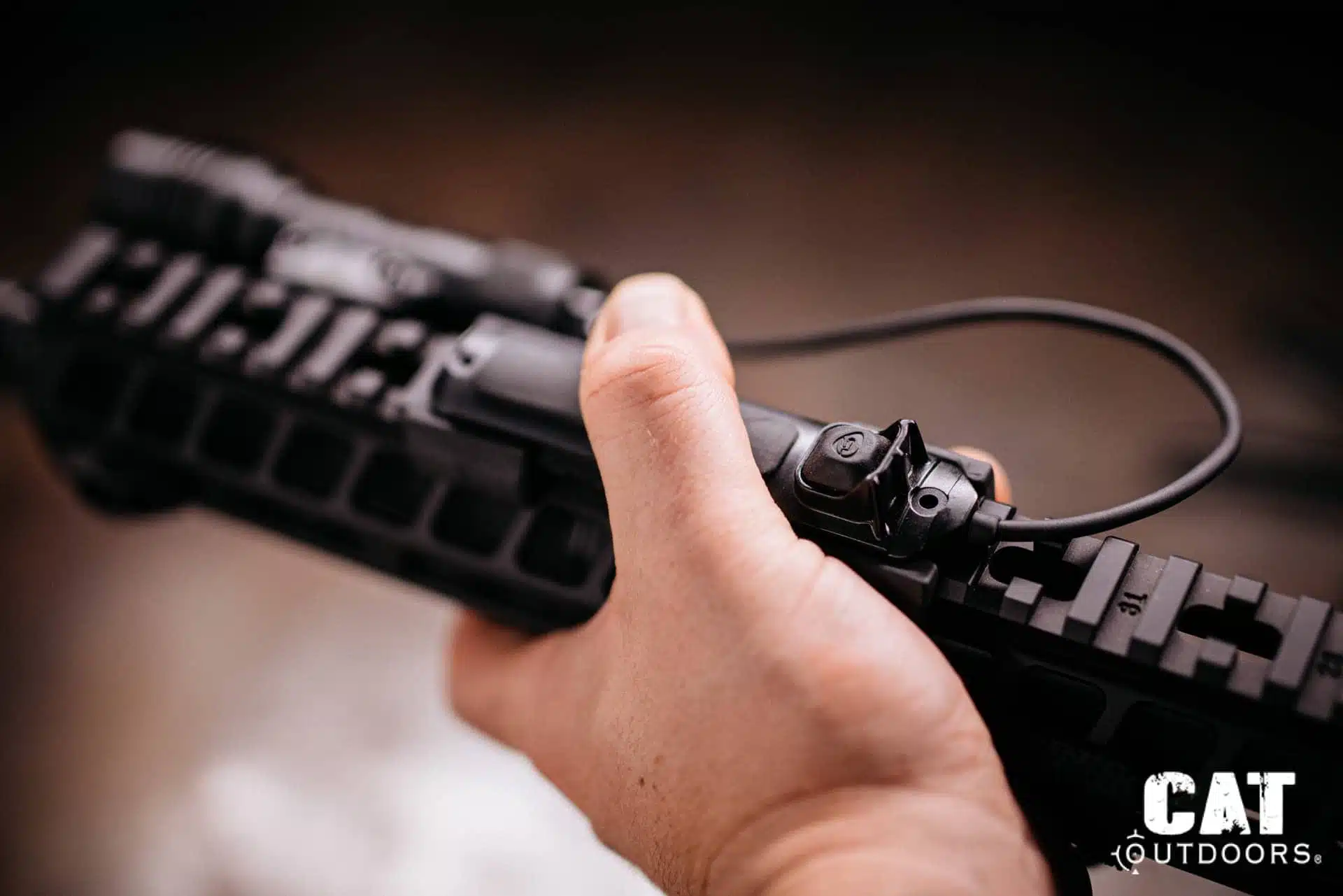 Thumb over the ProTac Rail Mount 1 tapeswitch on top of the rail