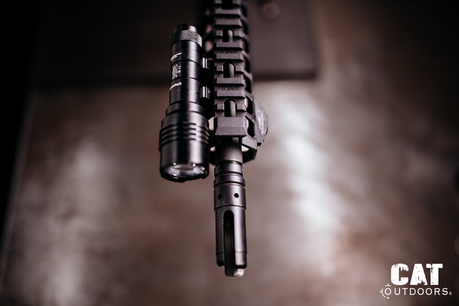 Top-down view of the ProTac Rail Mount 1 beside the muzzle on the bench