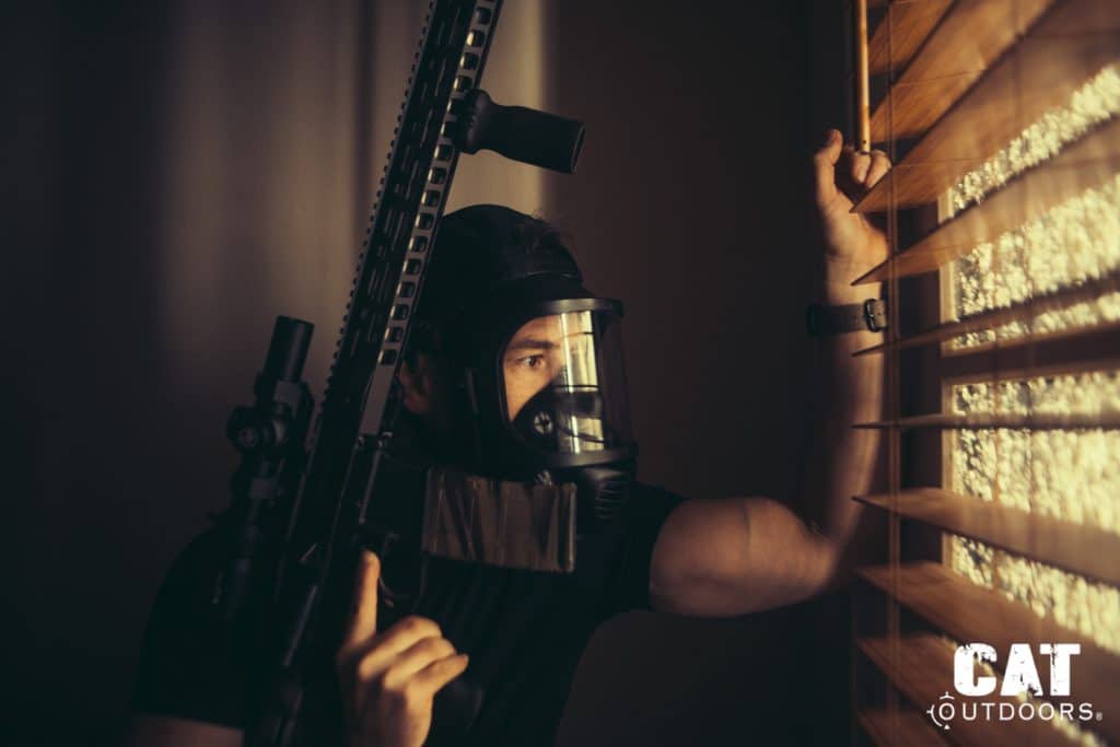 Peeking through window blinds while wearing the Mira Safety CM-8M gas mask