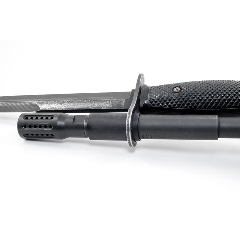 M9 bayonet mounted on an AR-15 barrel using a muzzle ring sleeve adapter