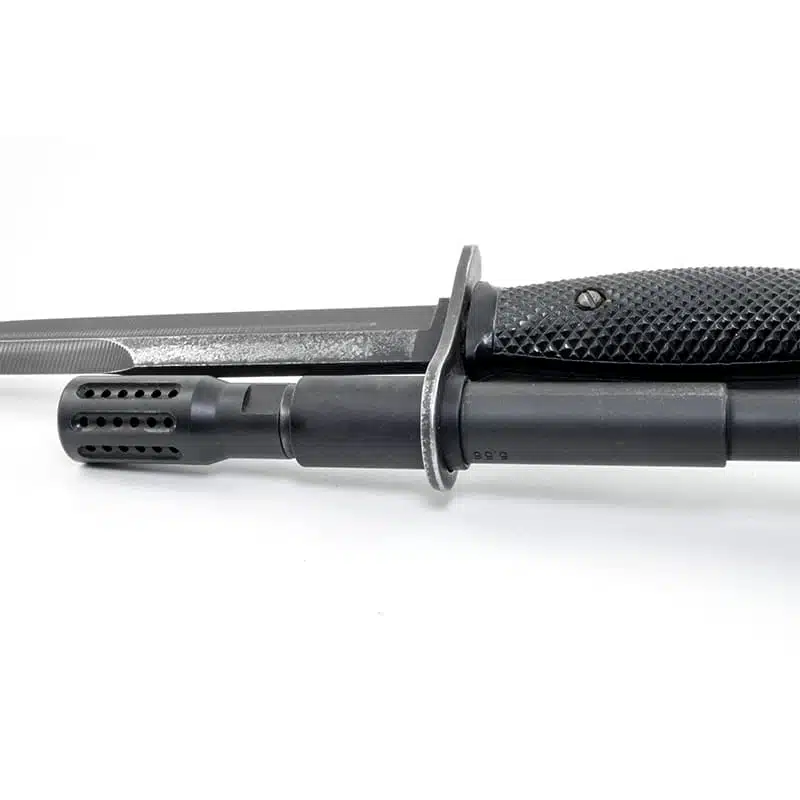 M9 bayonet mounted on an AR-15 barrel using a muzzle ring sleeve adapter