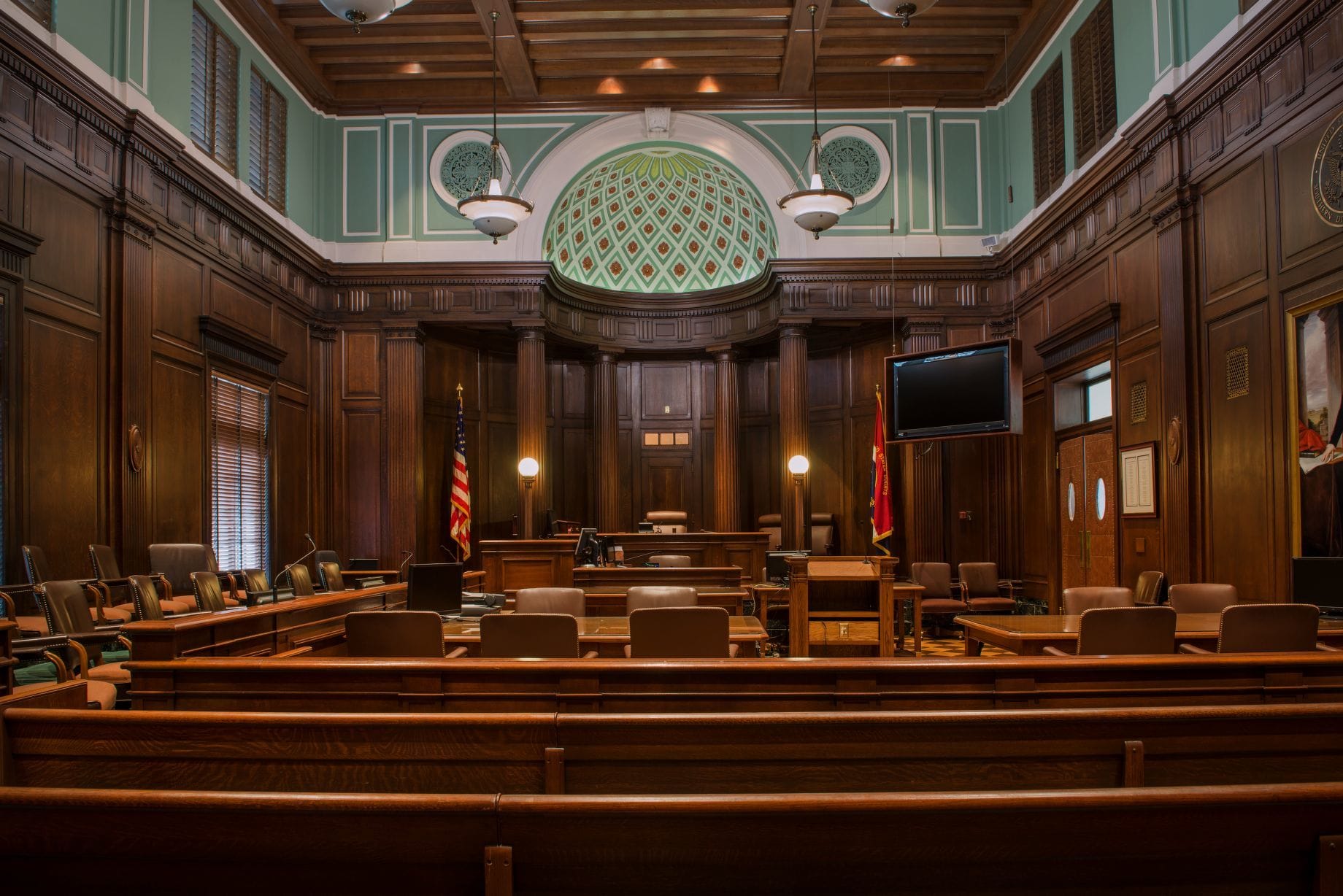 Empty federal courtroom with judge's bench