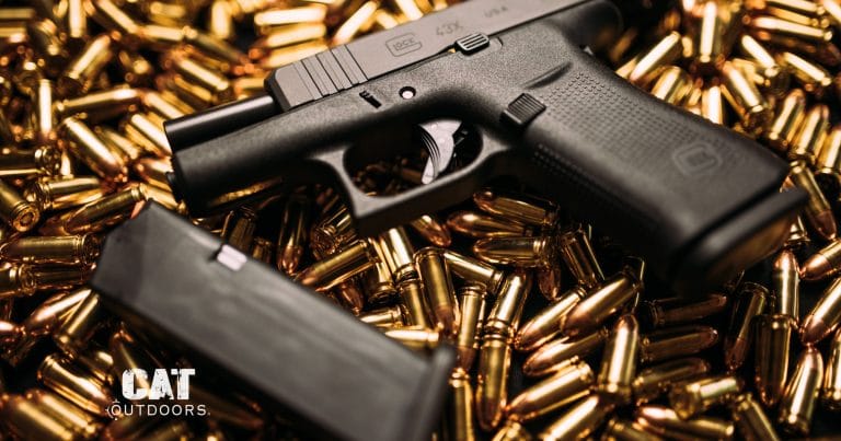 Glock 43X 9mm pistol on a bed of 9mm ammunition
