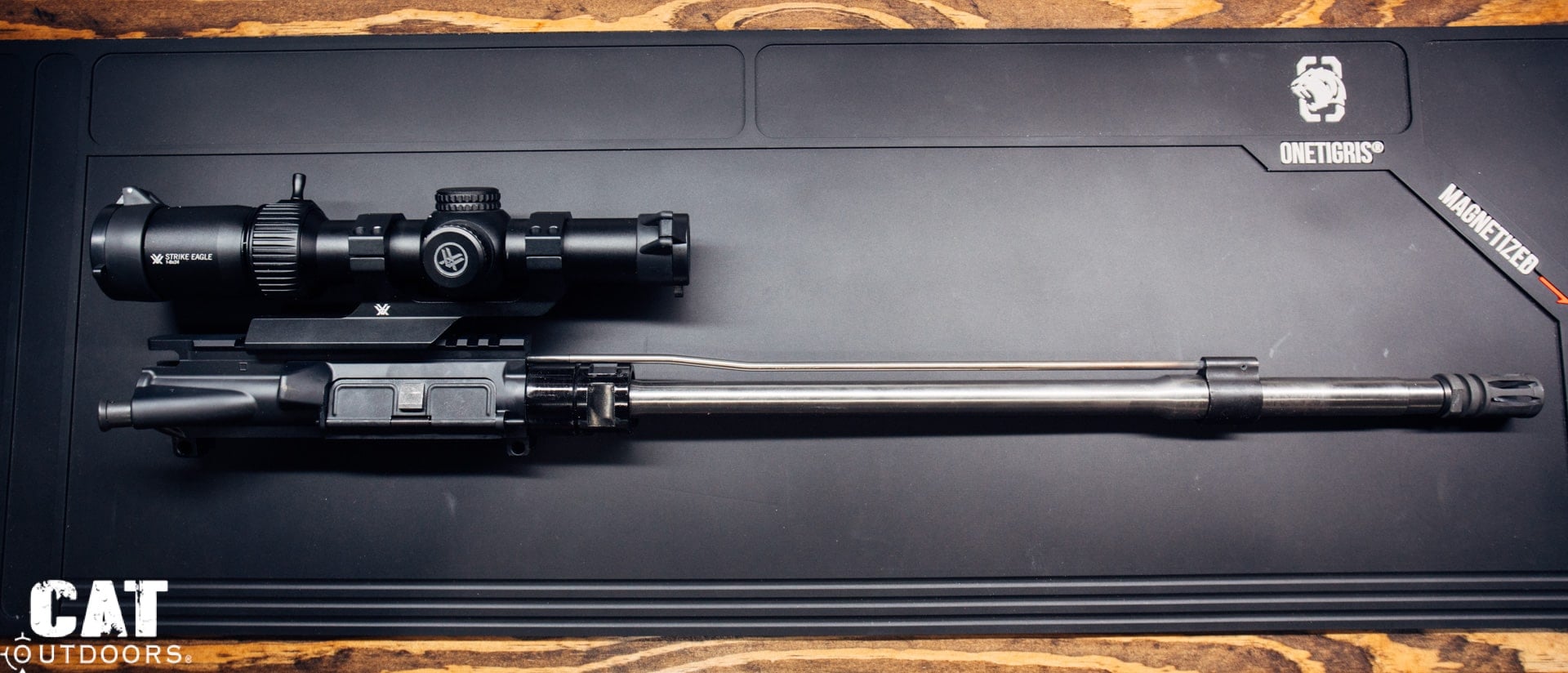 AR-15 barrel and upper receiver on a bench mat