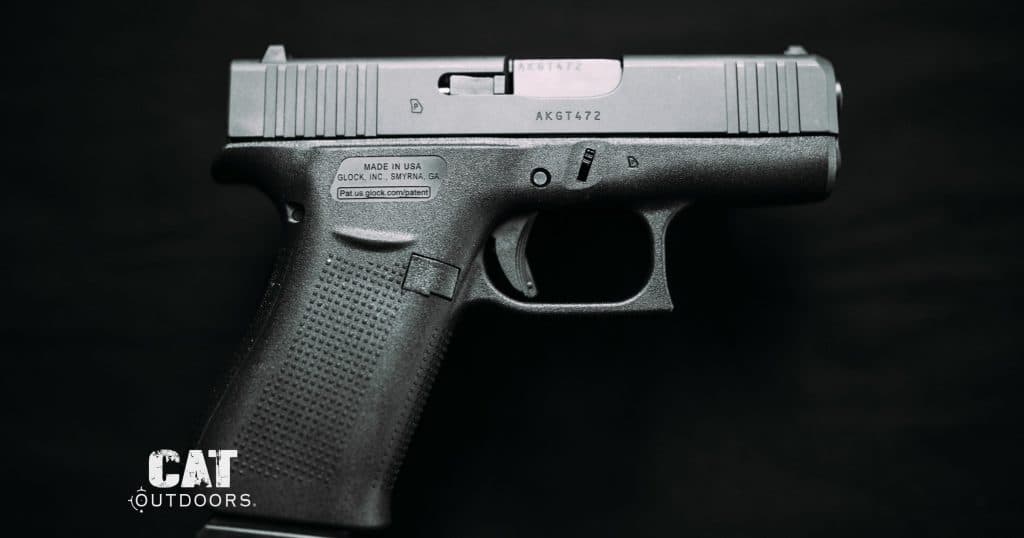 Glock 43X pistol side profile on a black background