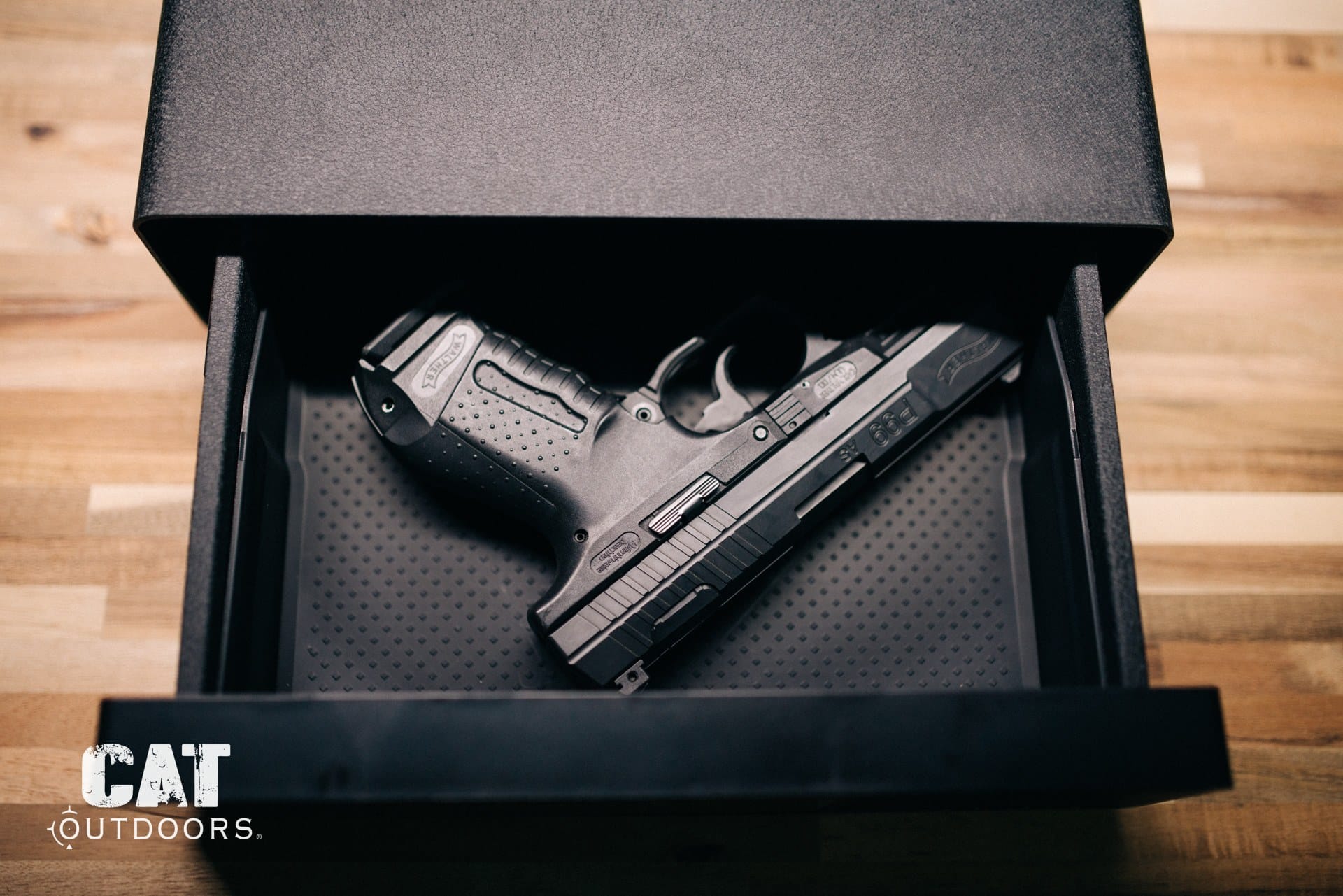 Walther P99 pistol stored in an open bedside drawer safe