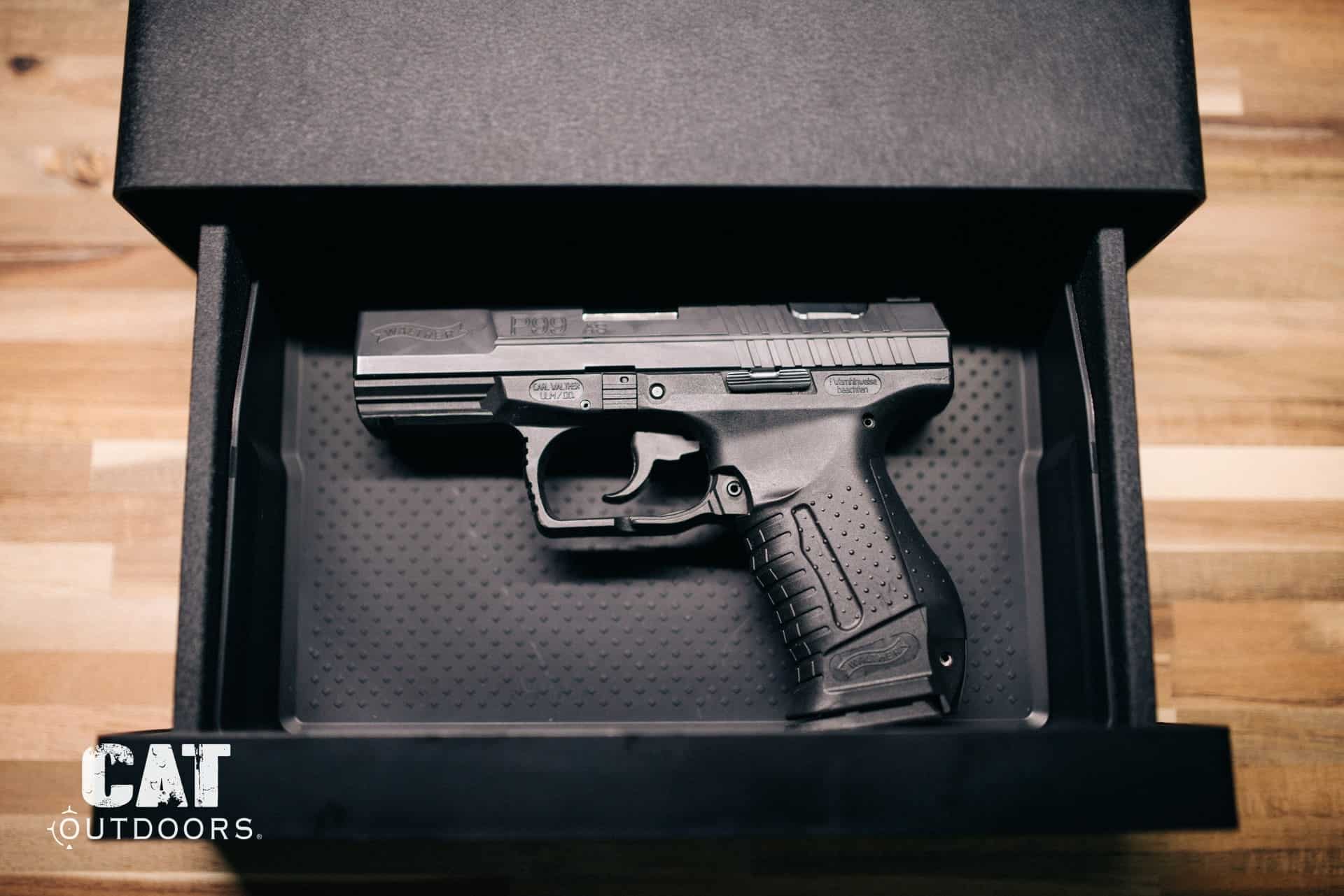 A Walther P99 pistol stored in an open bedside drawer safe