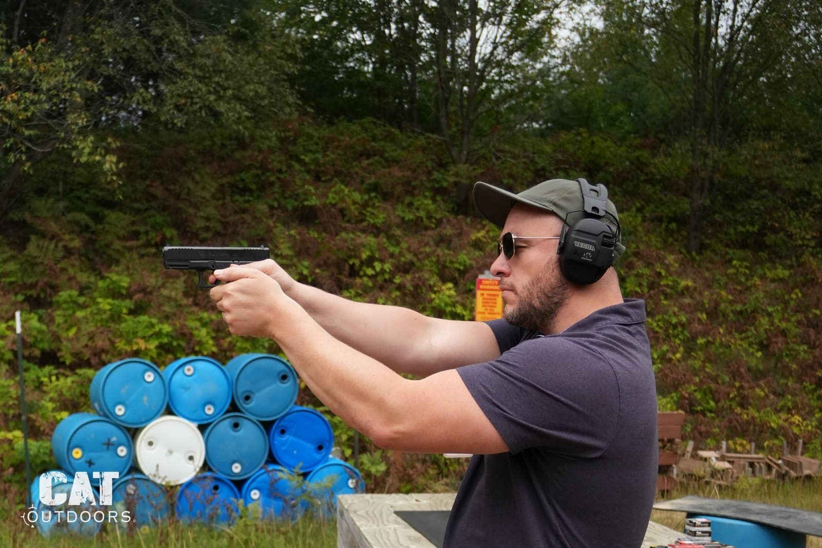 Shooting the Glock 19 Gen 5 two-handed with the barrel stack behind