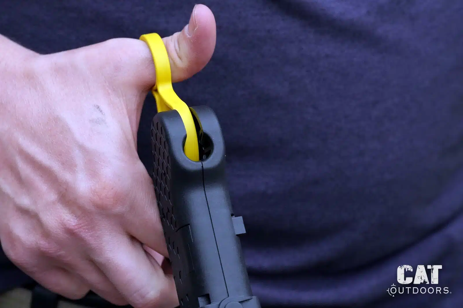 Thumb through the yellow ring of the Speed Beez loader, the flipped grip that worked better for us