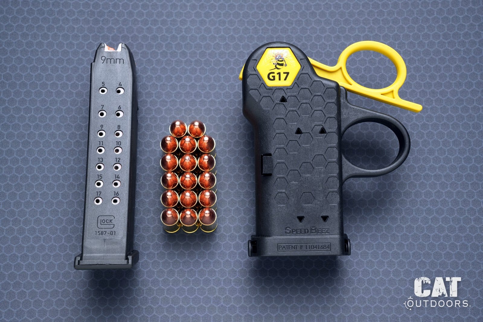 Glock factory 17-round magazine, 17 rounds of 9mm and the Speed Beez loader laid out for the timed test