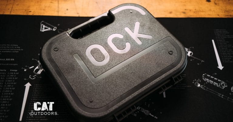Glock pistol case closed on a workbench gun mat