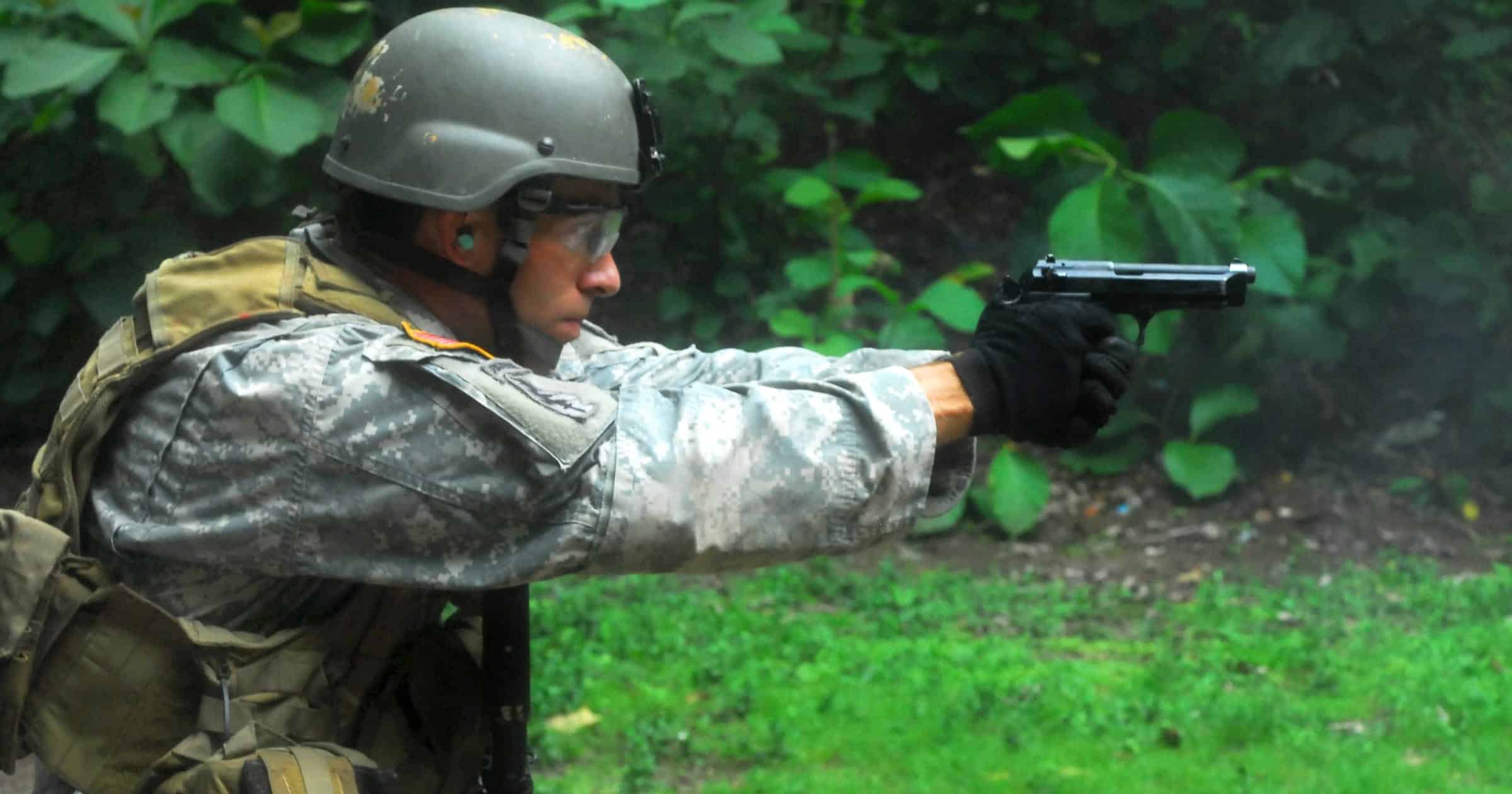U.S. special operations soldier firing a Beretta M9 pistol