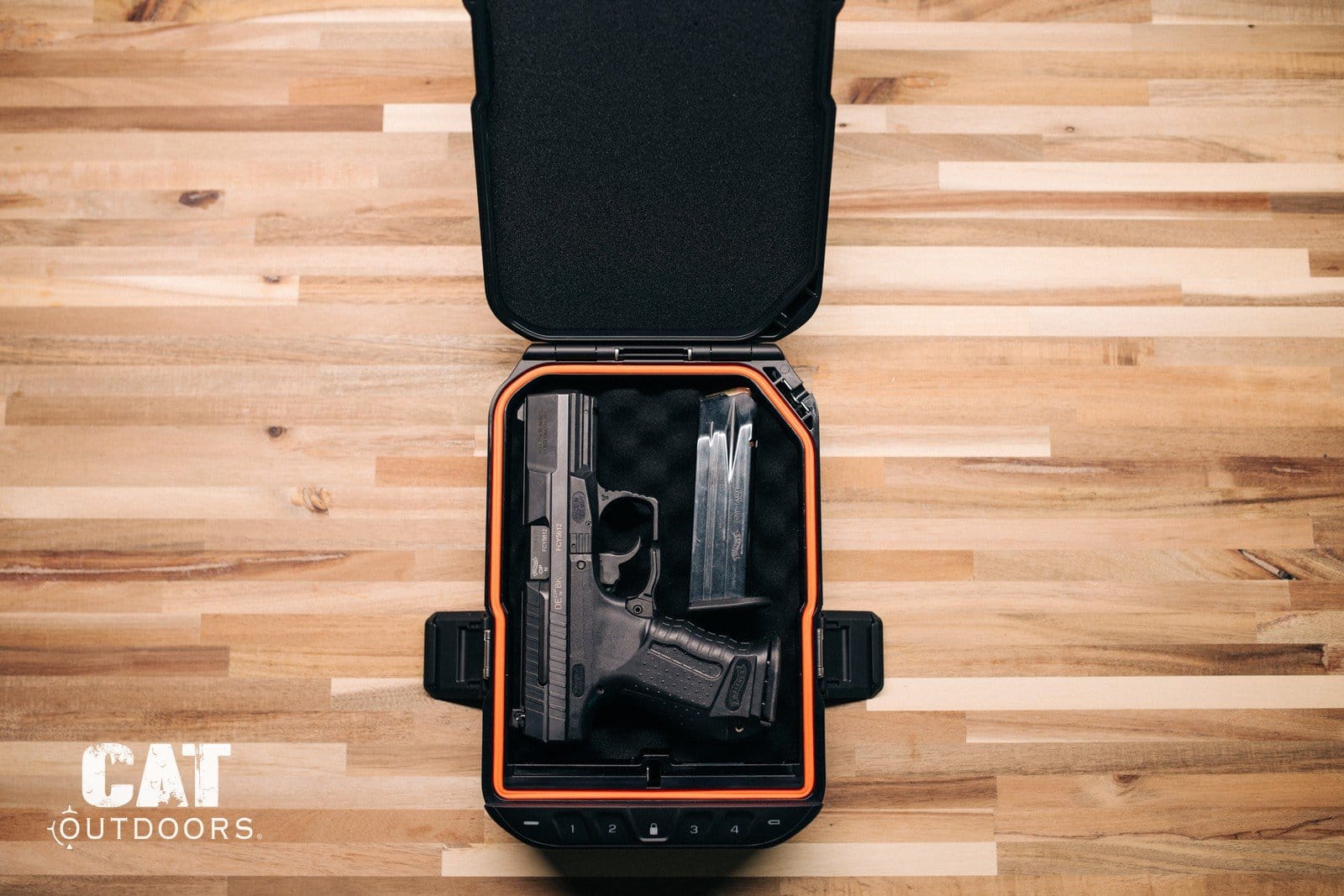 An unloaded handgun and a separate magazine inside an open locking hard case