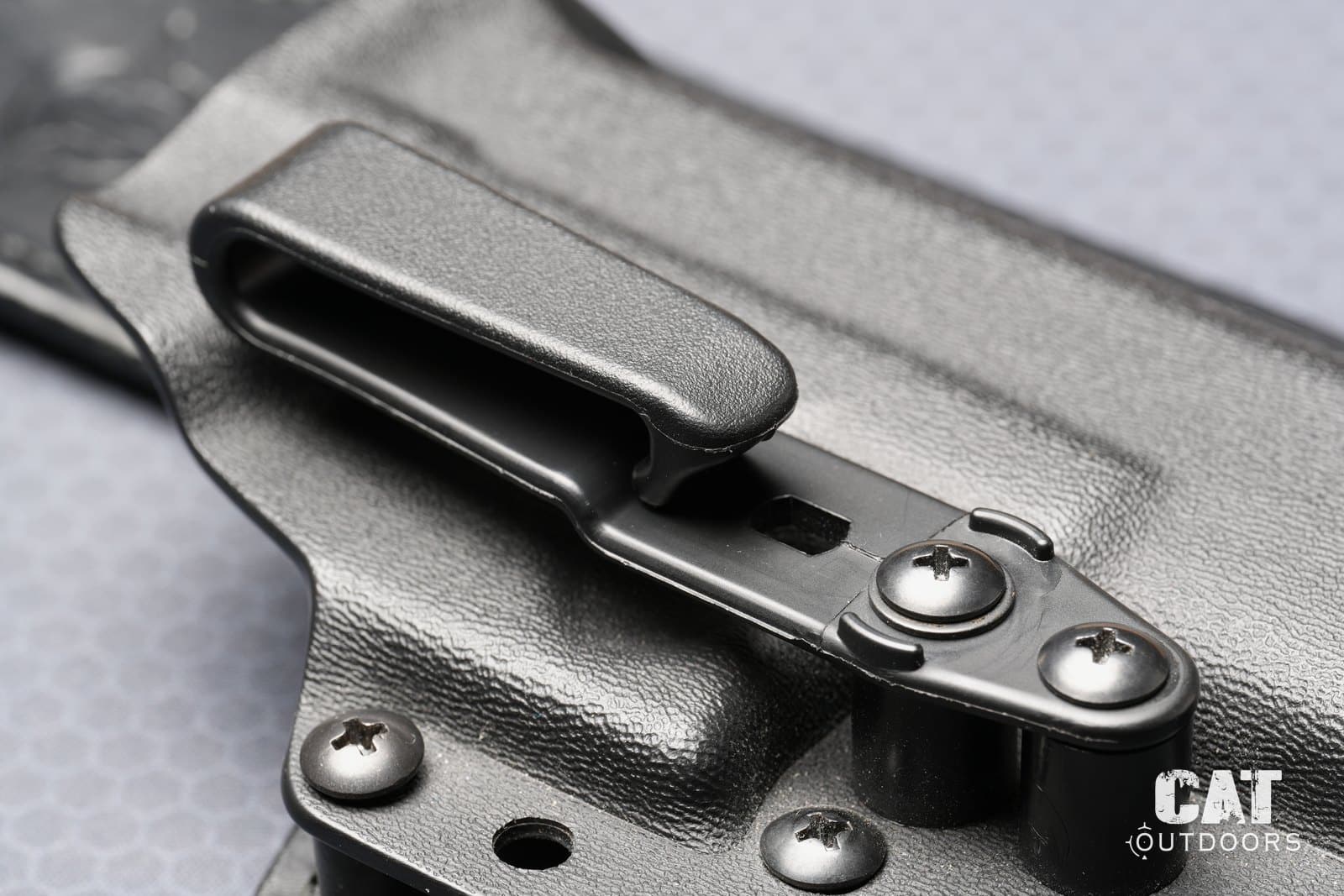 The Hidden Hybrid polymer belt clip, its adjustment slot and pivot screw
