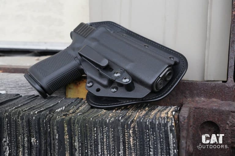 Hidden Hybrid holster review: the Single Clip IWB with a Glock 19 on a rusted steel bench