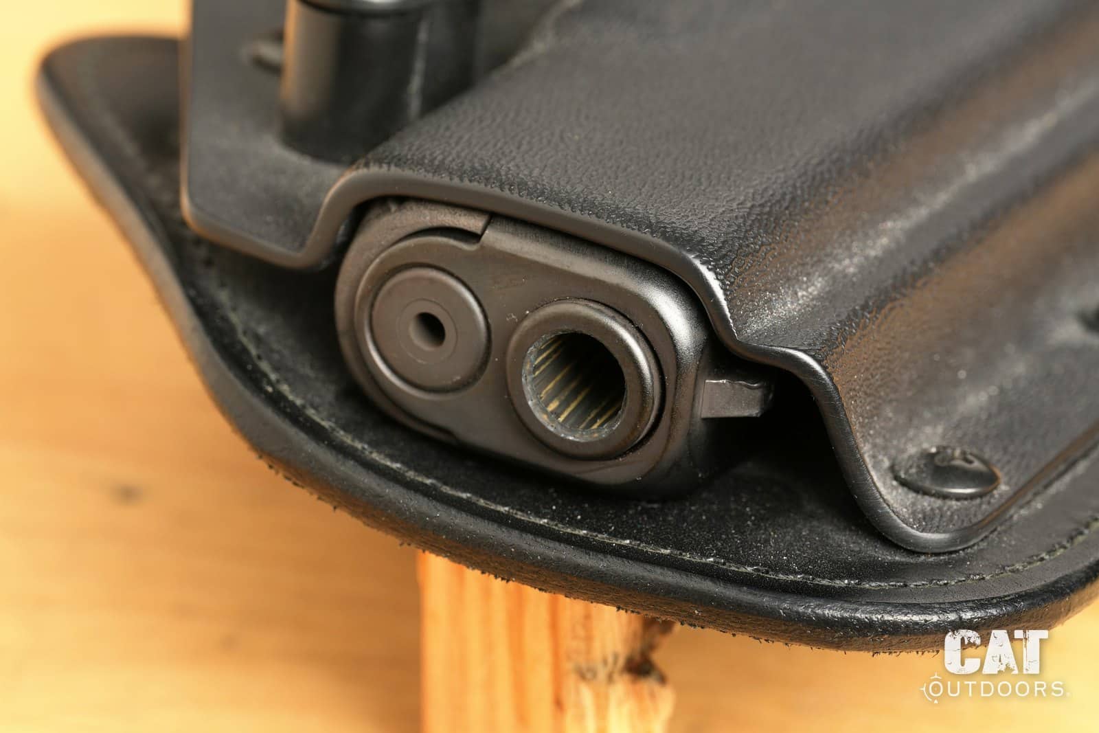 Open muzzle end of the Hidden Hybrid holster, Kydex and leather edge