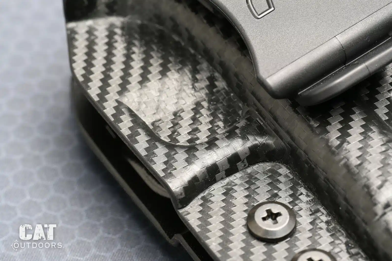 The molded dent around the trigger guard that makes the Rounded Gear holster click