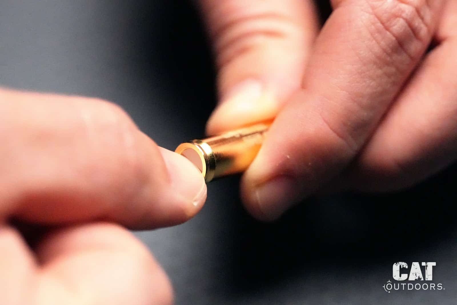 Turning the Sight-Rite laser bore sighter on with a fingernail