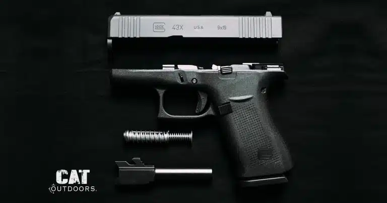 Field-stripped Glock 43X pistol showing the slide, frame, recoil spring, and barrel