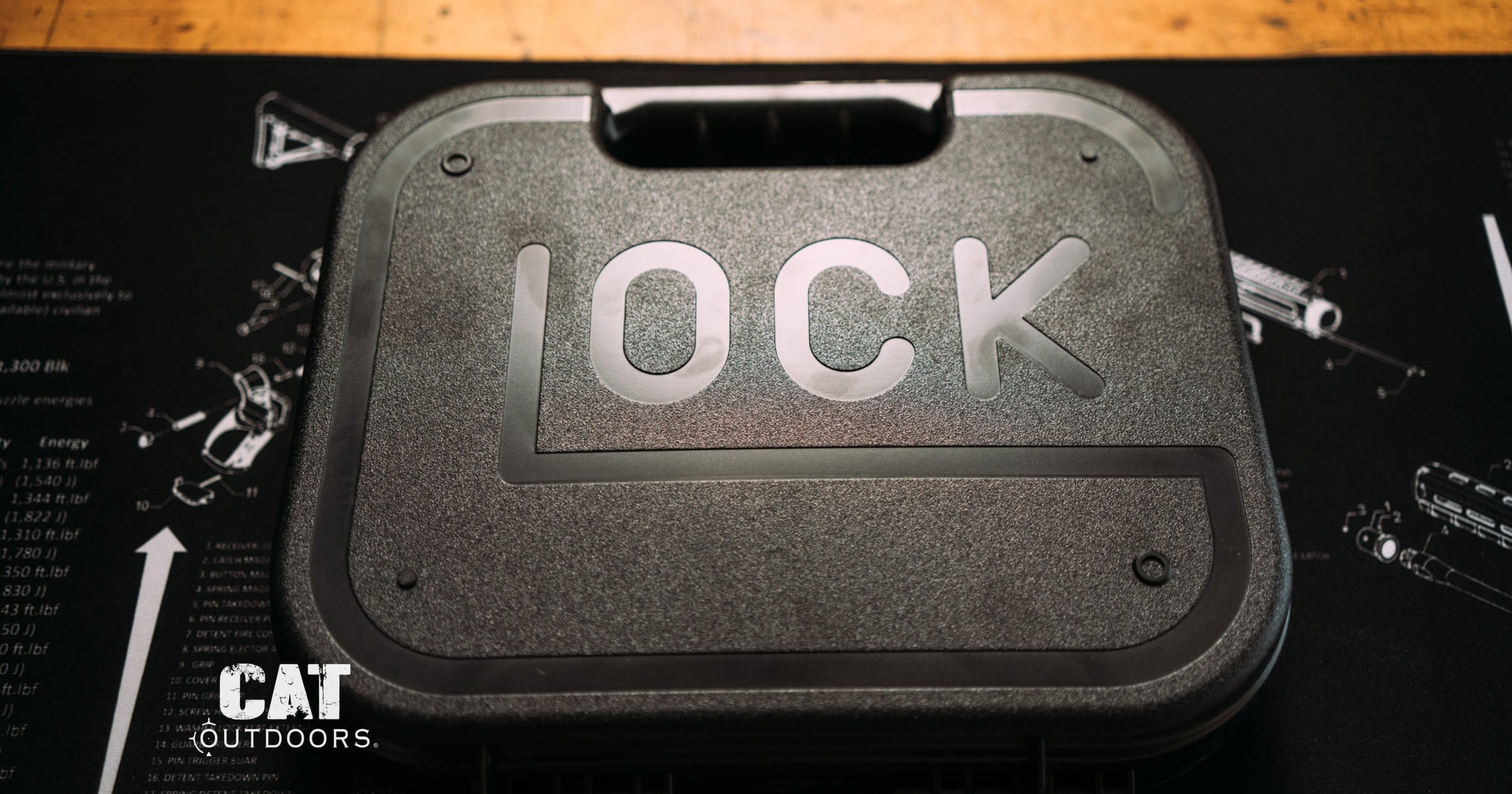 Closed Glock pistol case on a workbench